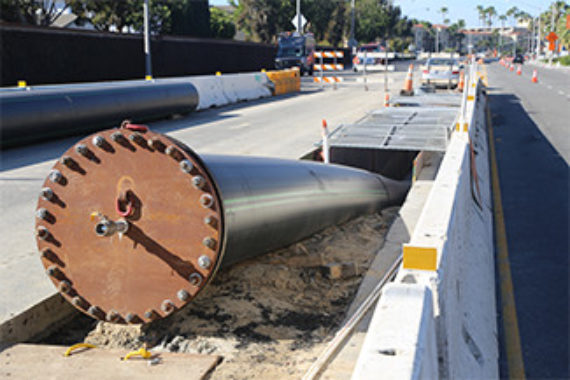 HDPE piping being installed underneath a historic highway